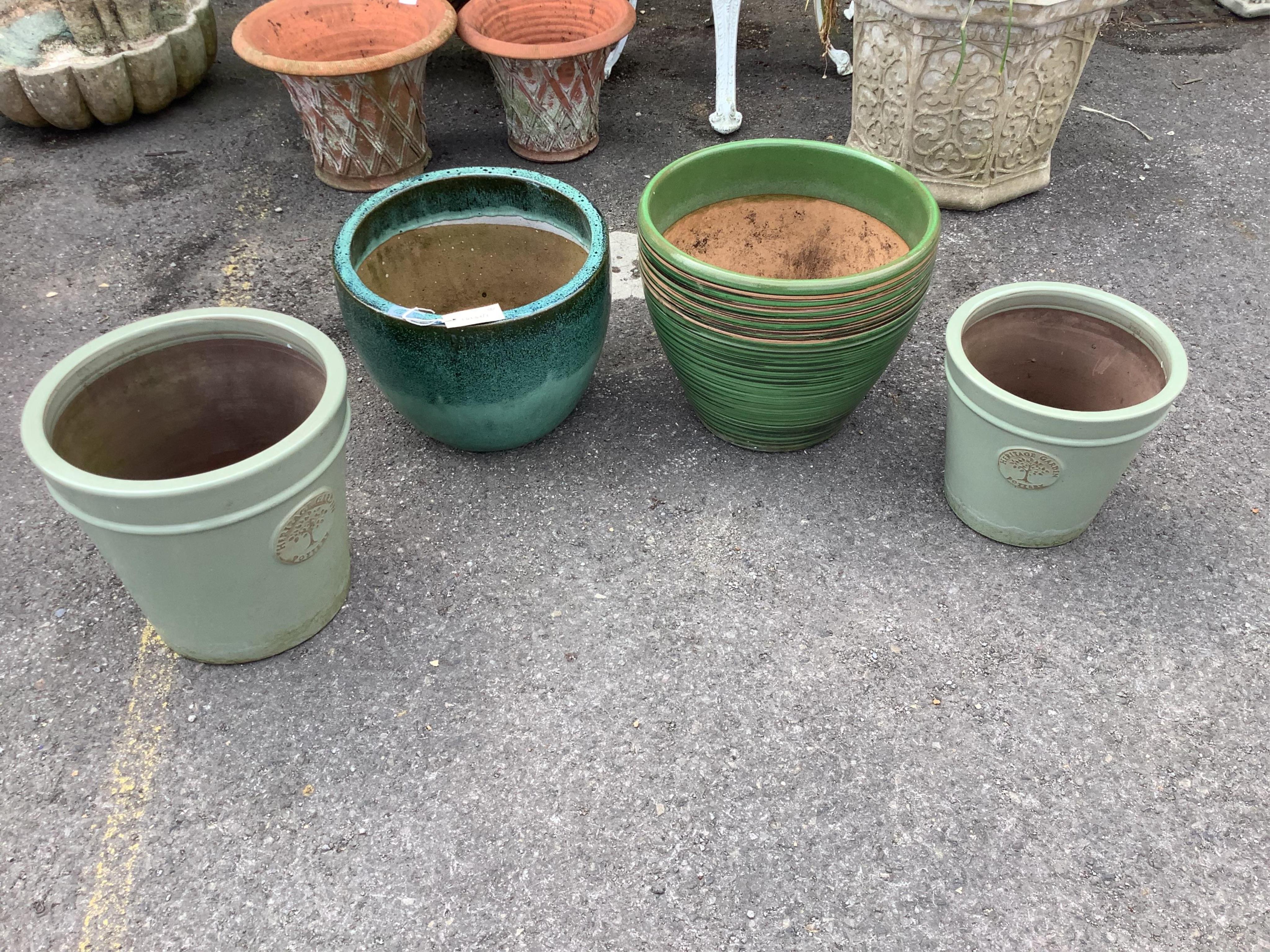 Four circular glazed earthenware garden planters, largest diameter 38cm, height 32cm. Condition - good